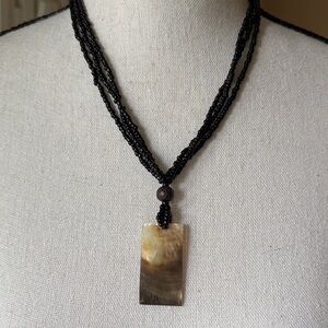 Black Beaded Necklace with Shell Pendant